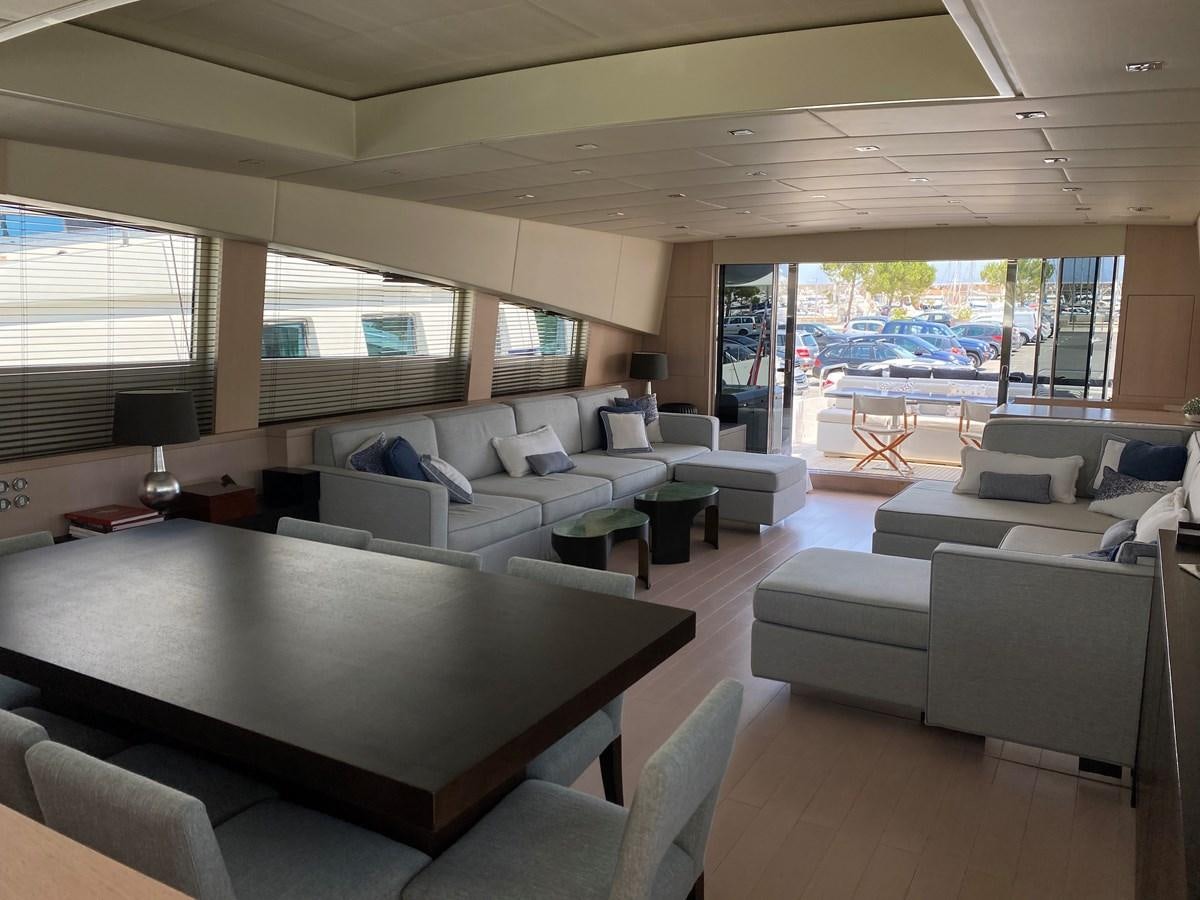 a living room with a large window aboard JADE Yacht for Sale