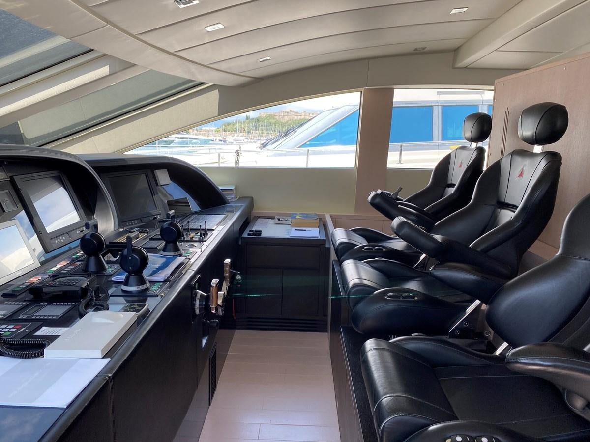 an airplane with seats and desks aboard JADE Yacht for Sale