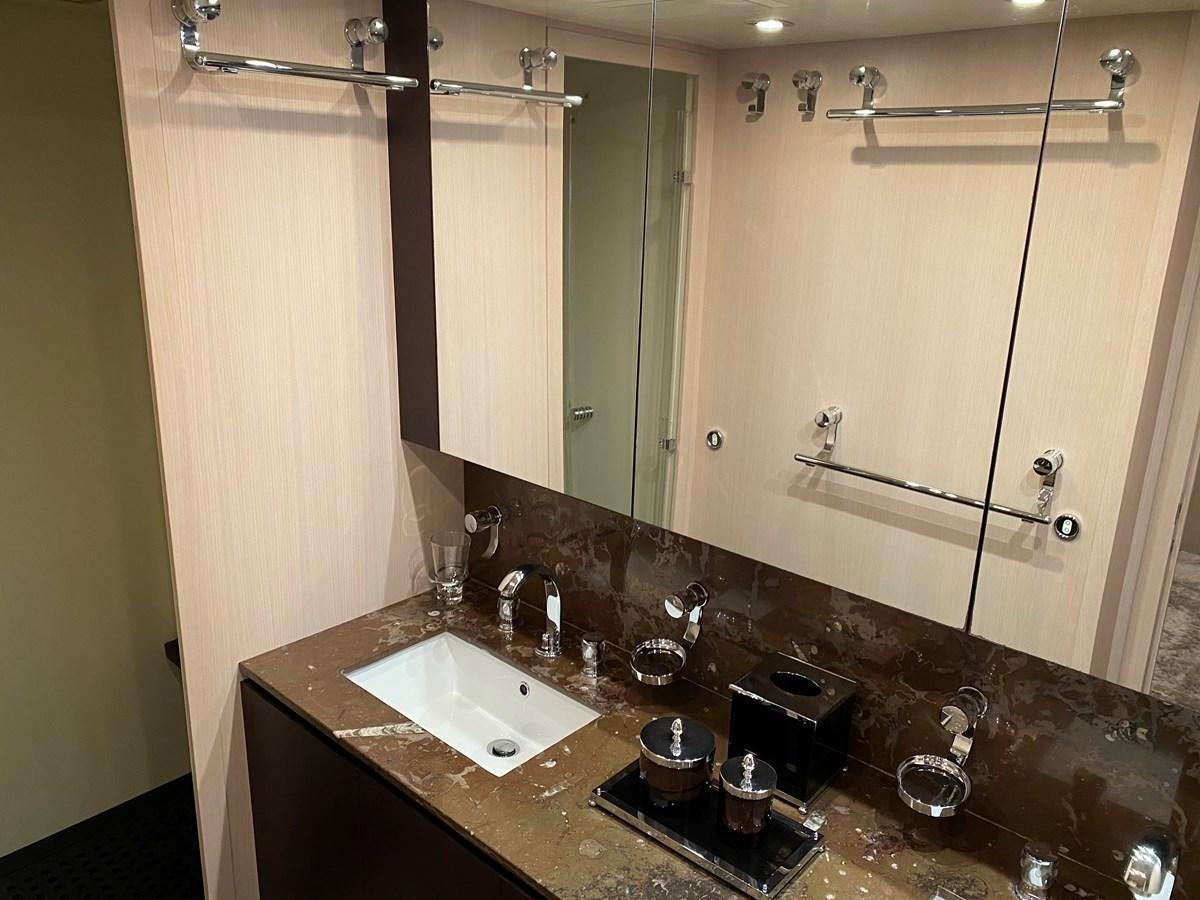 a bathroom with a large mirror aboard JADE Yacht for Sale
