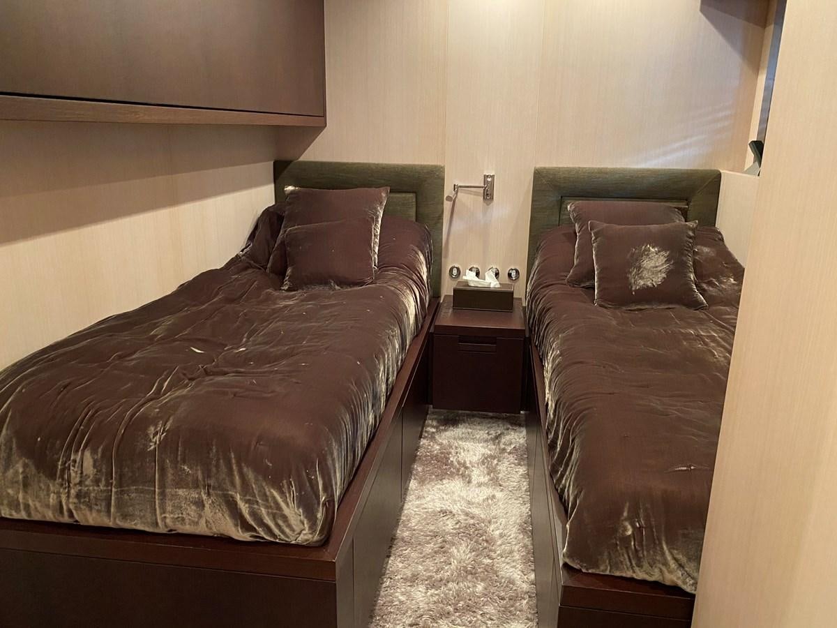 a couple of beds in a hotel room aboard JADE Yacht for Sale