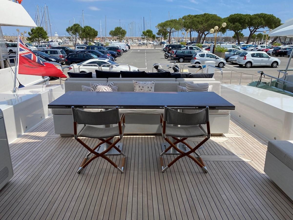 a table with chairs around it aboard JADE Yacht for Sale