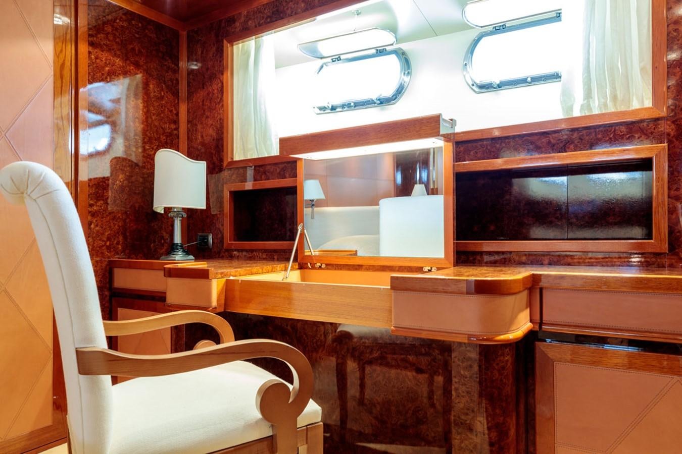 a room with chairs and a fireplace aboard PARAM JAMUNA III Yacht for Sale