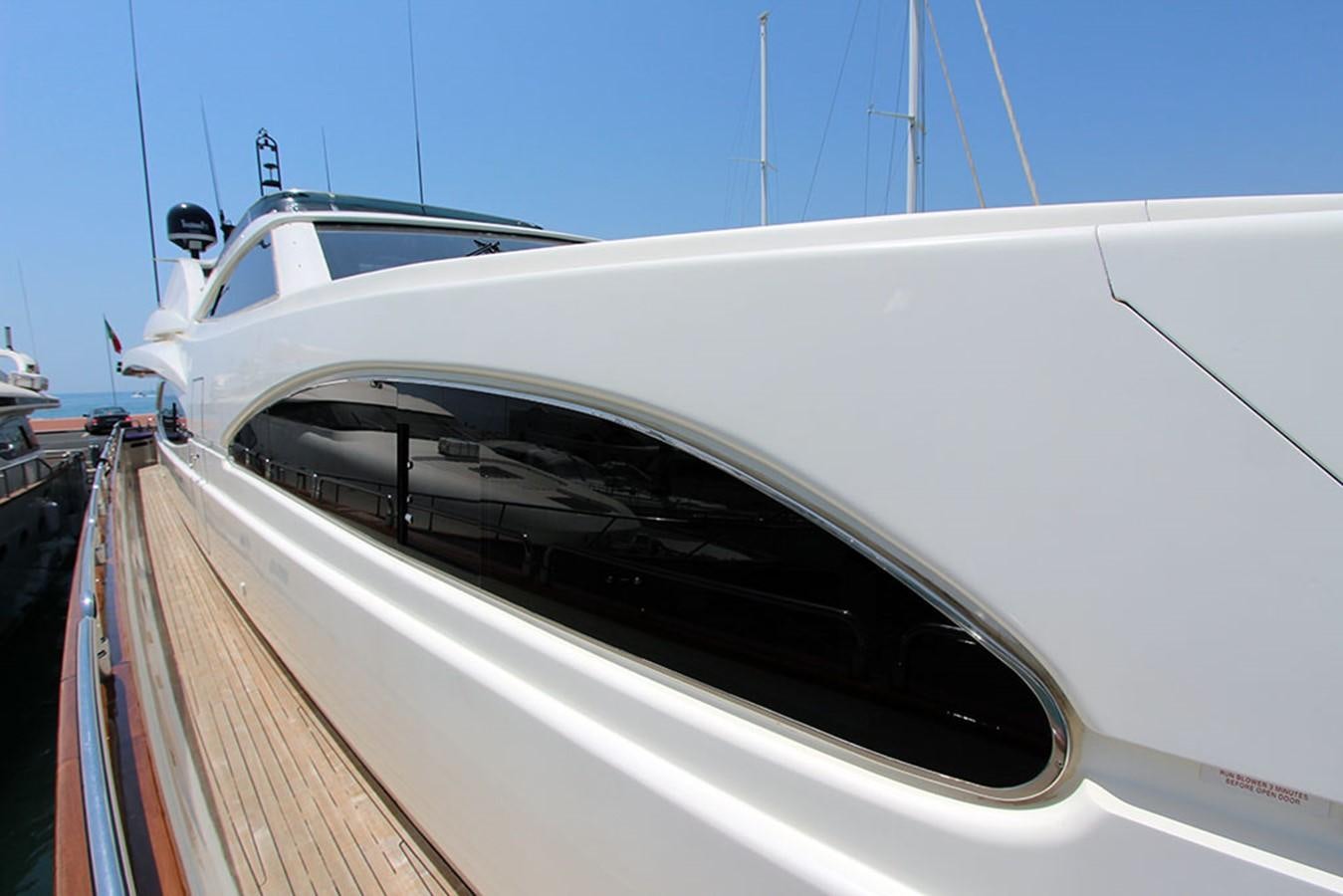 a white boat on a dock aboard MARIA JOSE Yacht for Sale