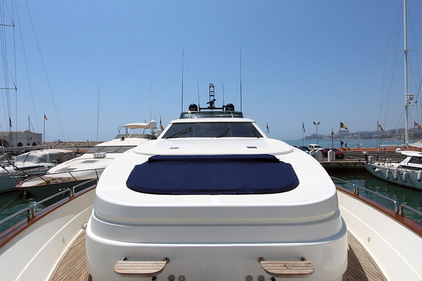 a white yacht in a harbor aboard MARIA JOSE Yacht for Sale