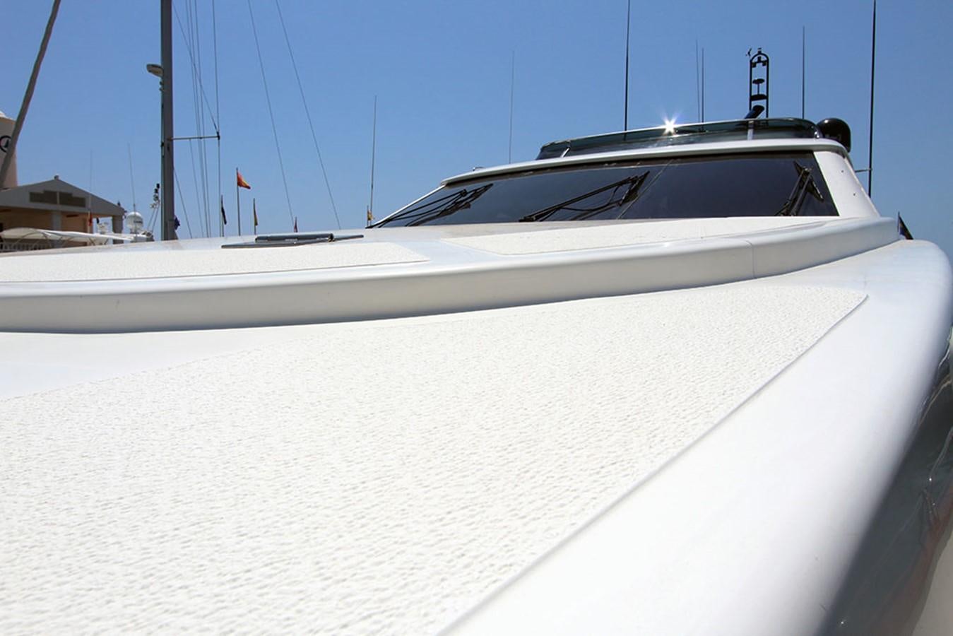 a white yacht on a dock aboard MARIA JOSE Yacht for Sale