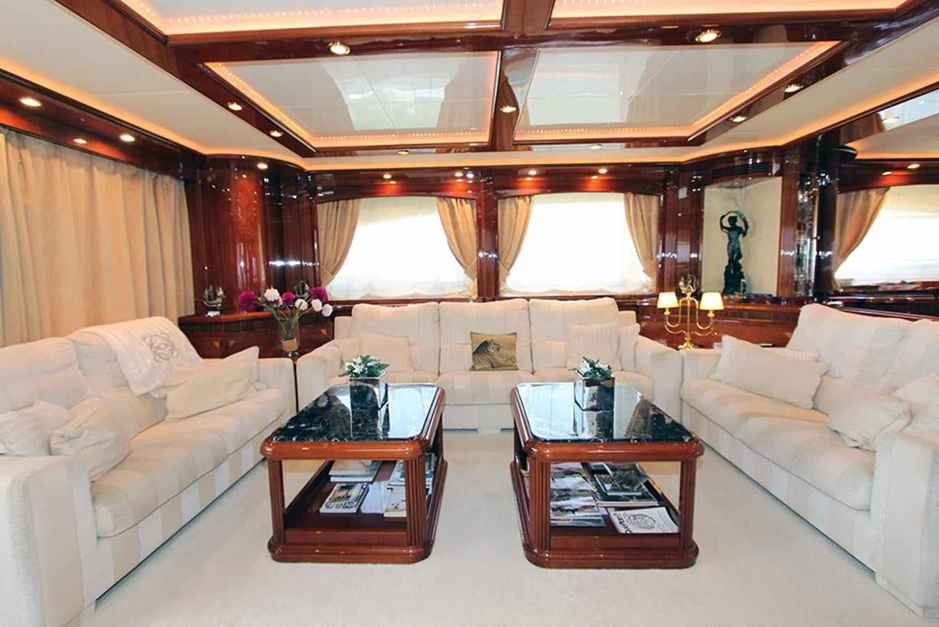 a living room with a couch and a coffee table aboard MARIA JOSE Yacht for Sale