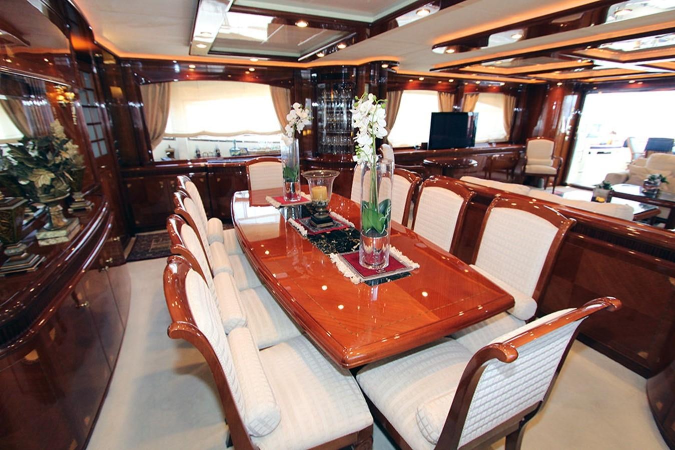 a dining room with a table and chairs aboard MARIA JOSE Yacht for Sale