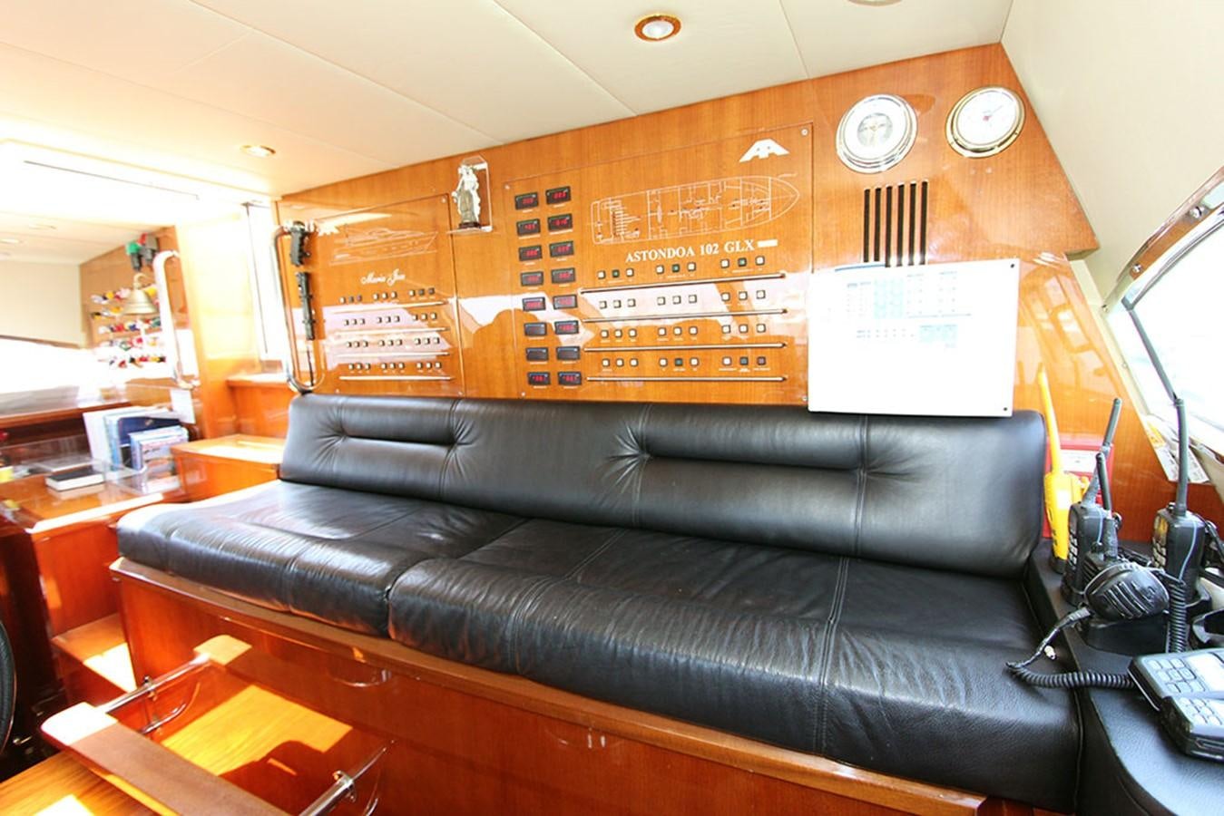 a leather couch in a room aboard MARIA JOSE Yacht for Sale