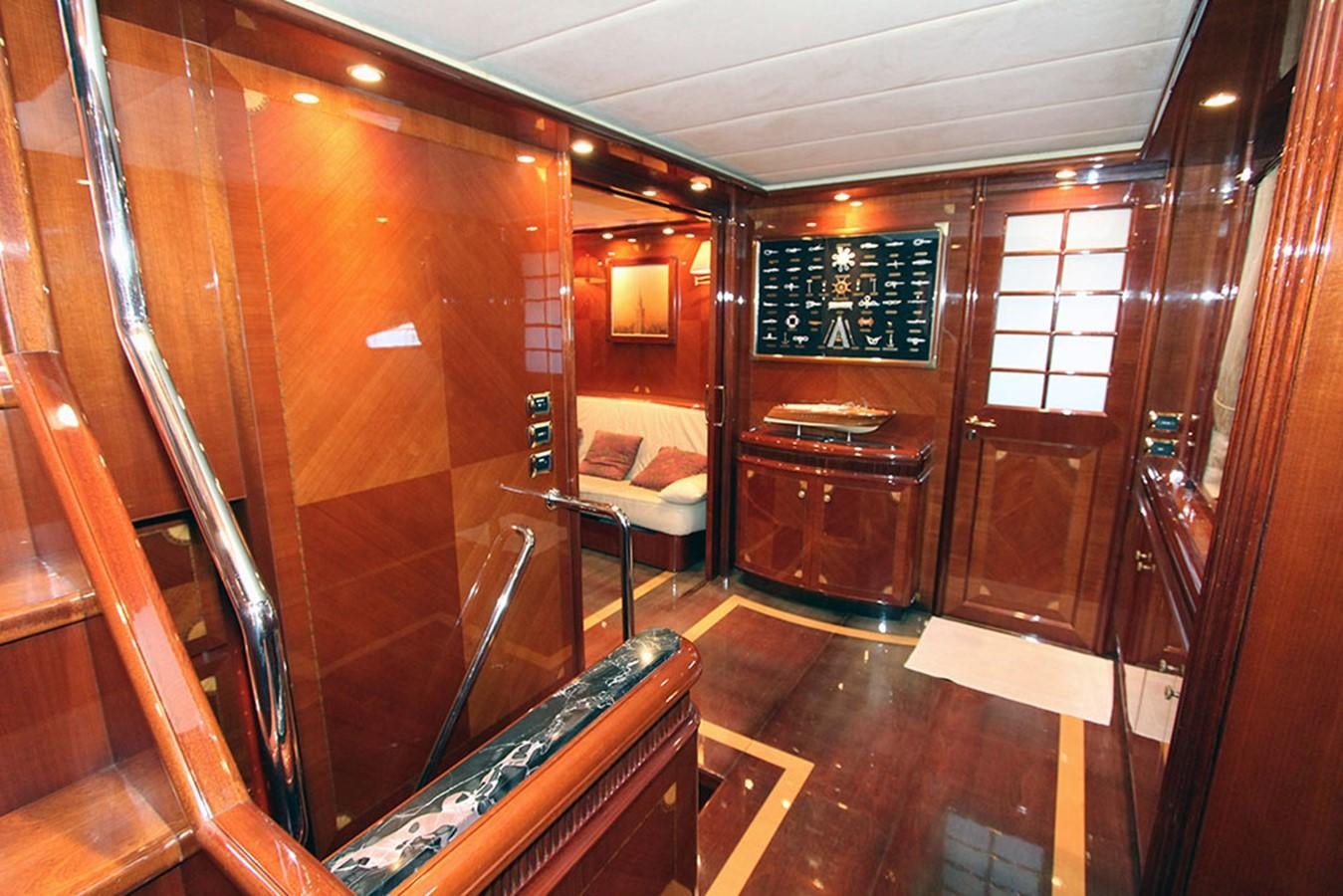 a room with wooden walls and wood furniture aboard MARIA JOSE Yacht for Sale