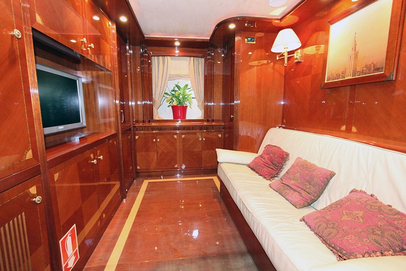 a room with a bed and a television aboard MARIA JOSE Yacht for Sale