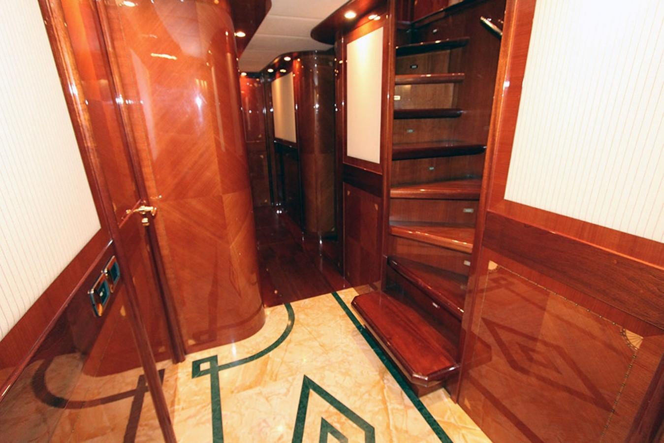 a room with a ladder and a wood cabinet aboard MARIA JOSE Yacht for Sale