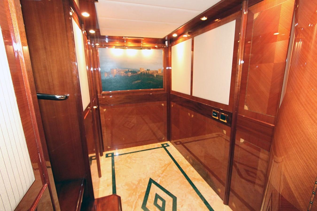 a room with a glass door aboard MARIA JOSE Yacht for Sale