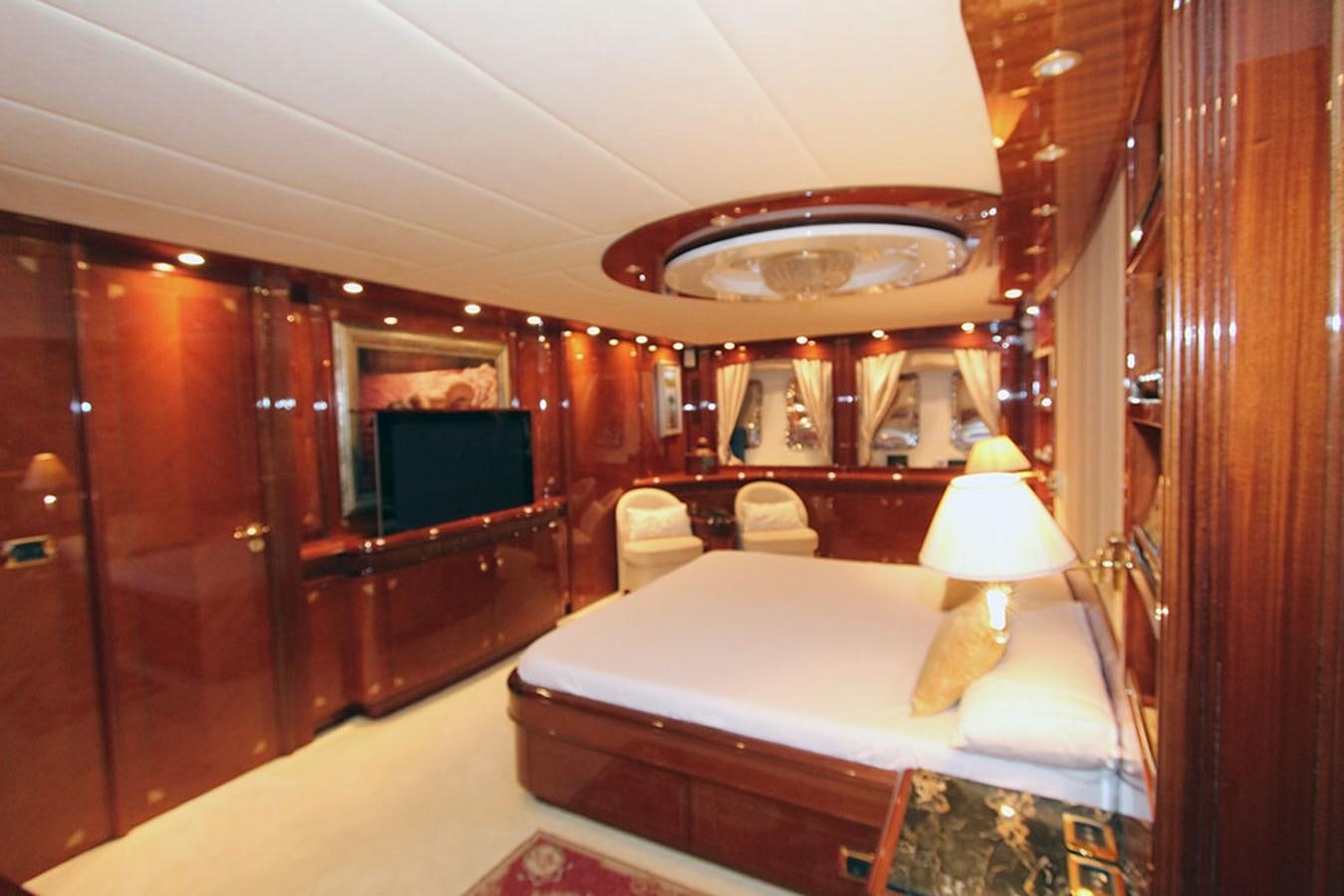 a room with a bed and a television aboard MARIA JOSE Yacht for Sale