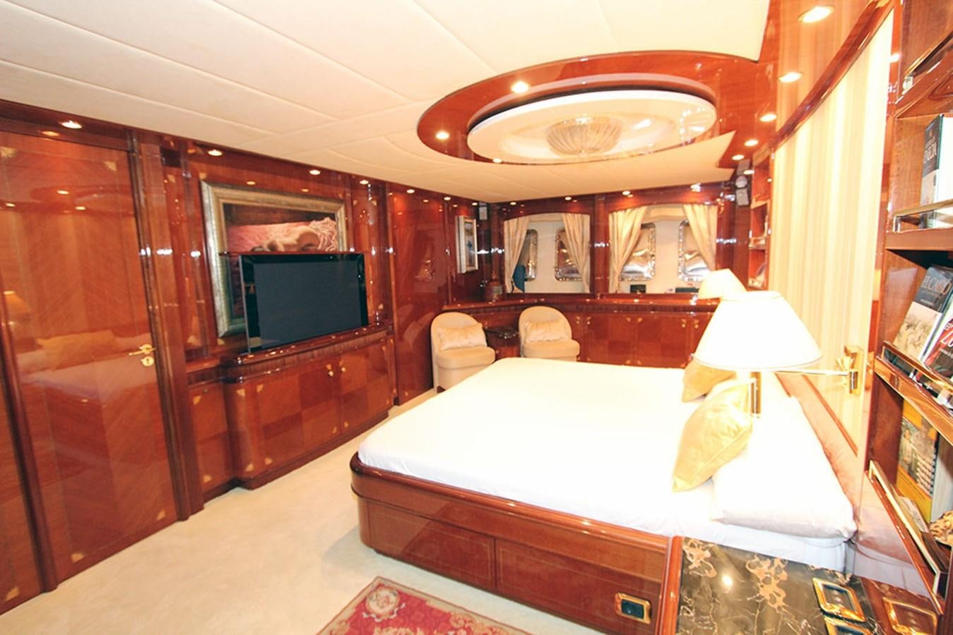 a bedroom with a bed and a television aboard MARIA JOSE Yacht for Sale