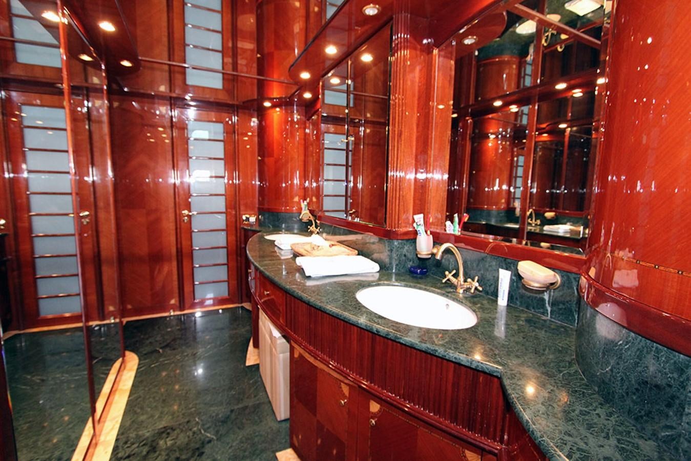 a bathroom with a countertop sink and a mirror aboard MARIA JOSE Yacht for Sale