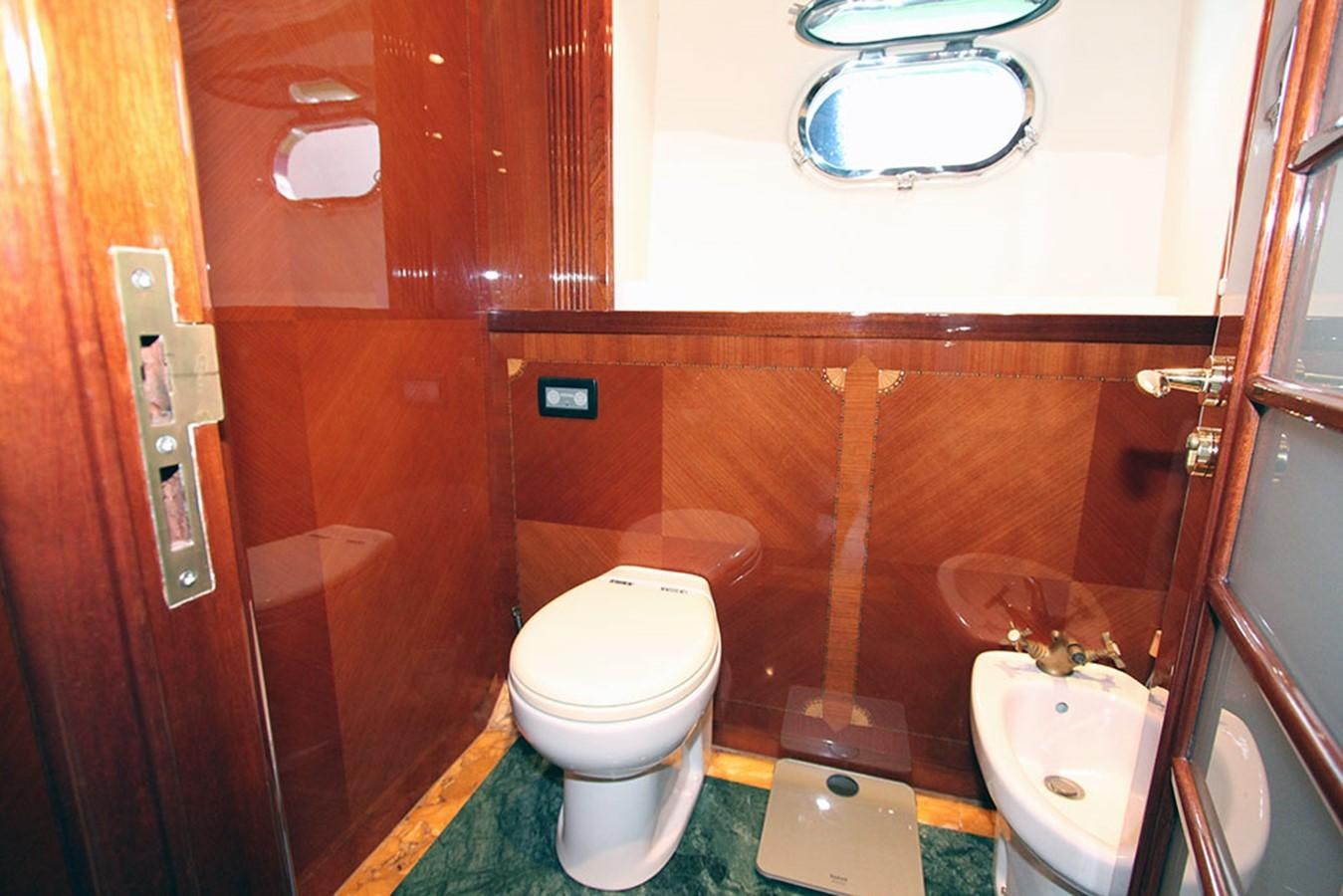 a bathroom with a toilet sink and a mirror aboard MARIA JOSE Yacht for Sale