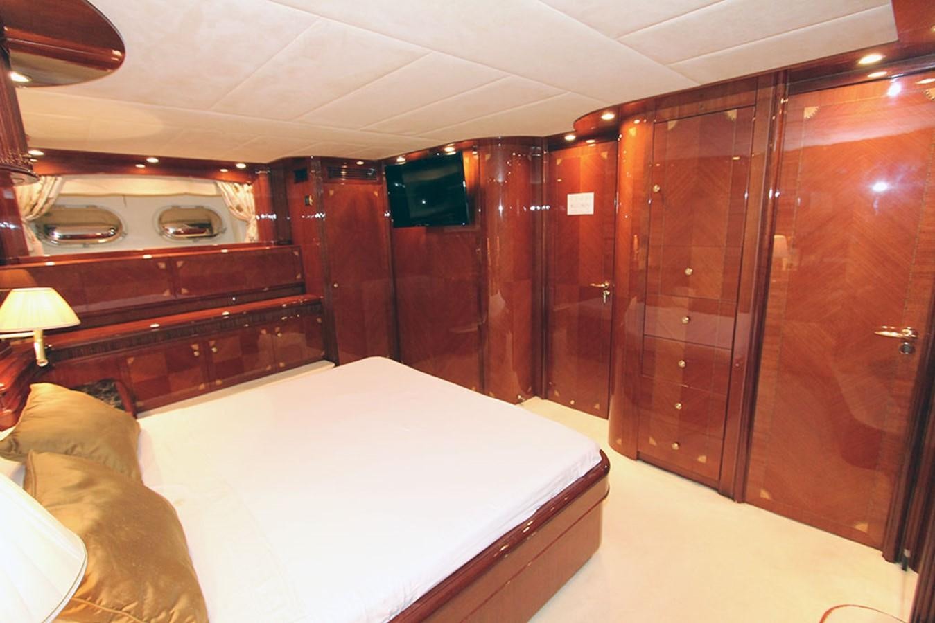 a room with a bed and a desk aboard MARIA JOSE Yacht for Sale