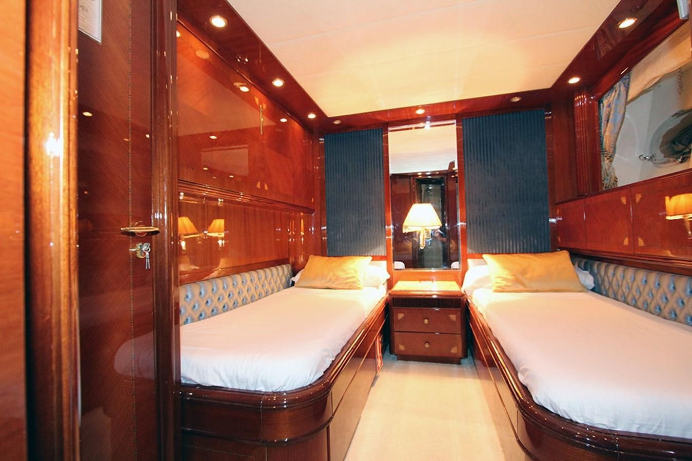 a room with a bed and a mirror aboard MARIA JOSE Yacht for Sale