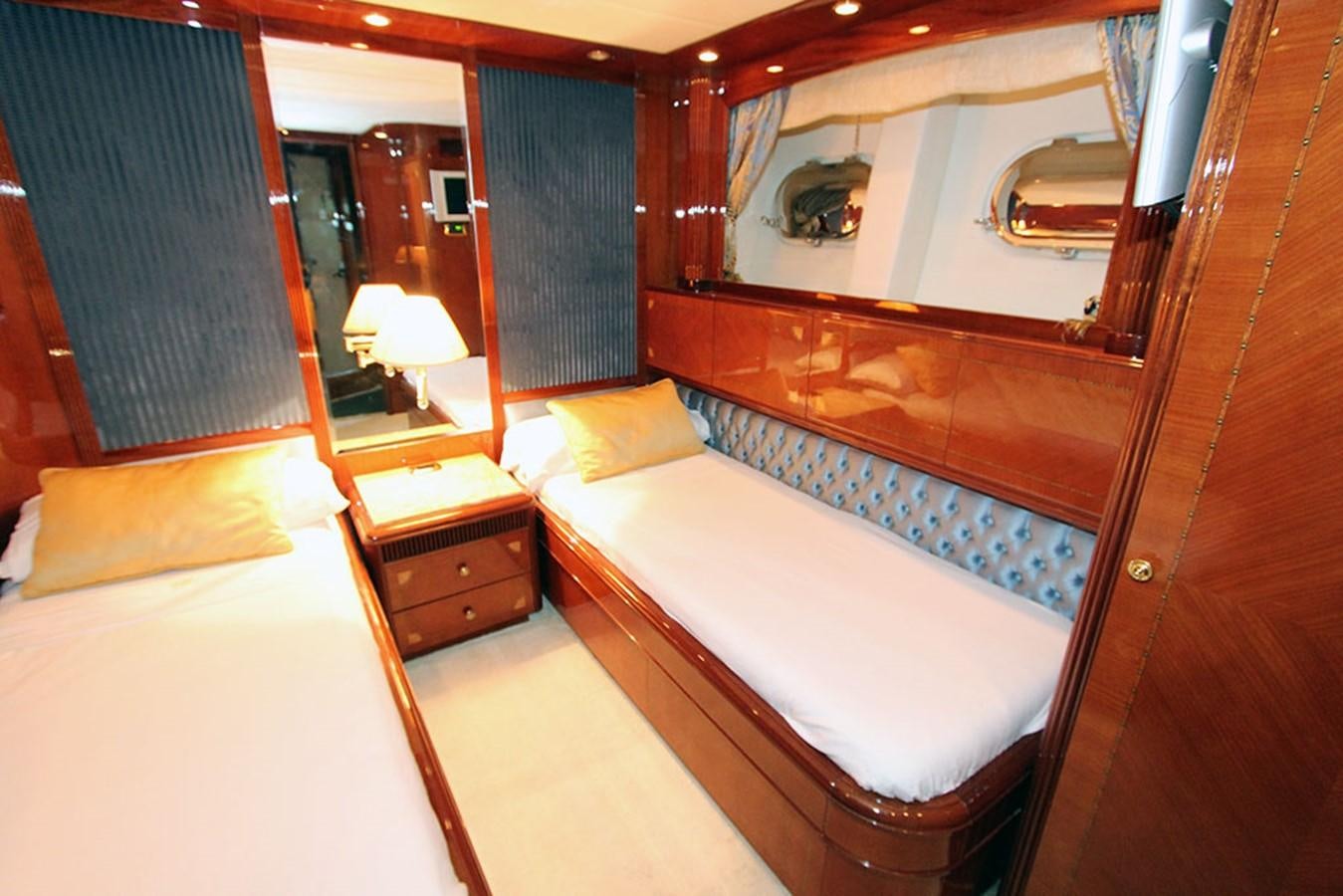 a room with a bed and a mirror aboard MARIA JOSE Yacht for Sale