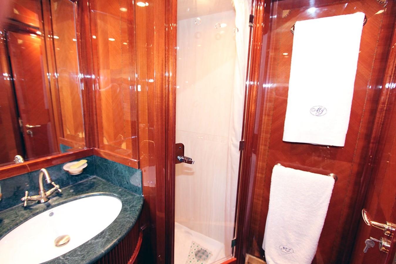 a bathroom with a sink and a mirror aboard MARIA JOSE Yacht for Sale