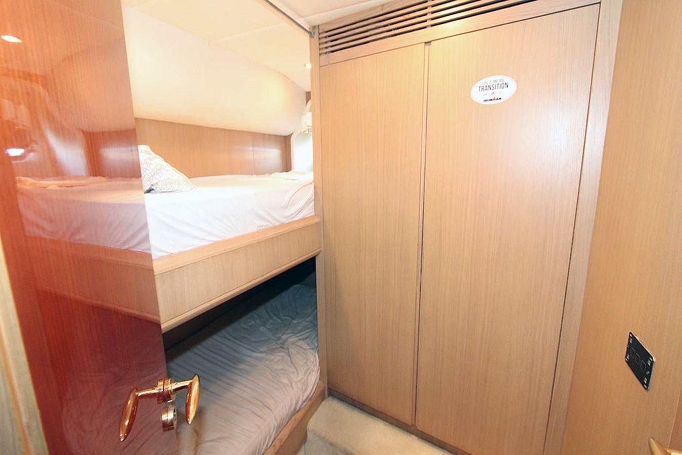 a room with a bed and a closet aboard MARIA JOSE Yacht for Sale