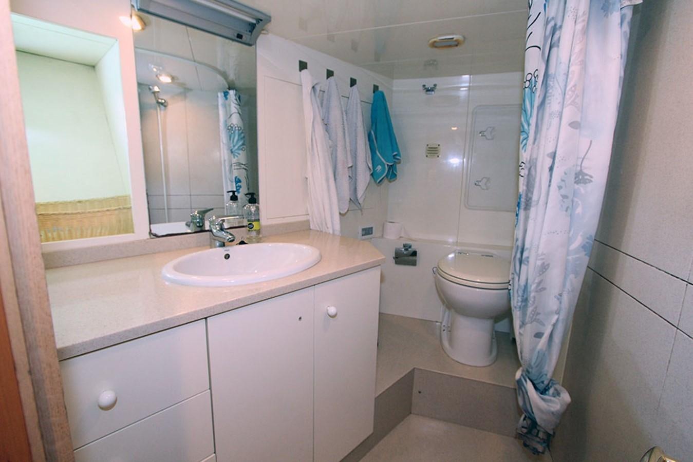 a bathroom with a sink and toilet aboard MARIA JOSE Yacht for Sale