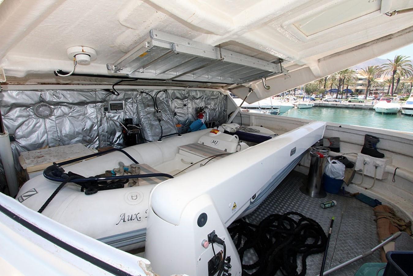 a white boat with a black object on it aboard MARIA JOSE Yacht for Sale