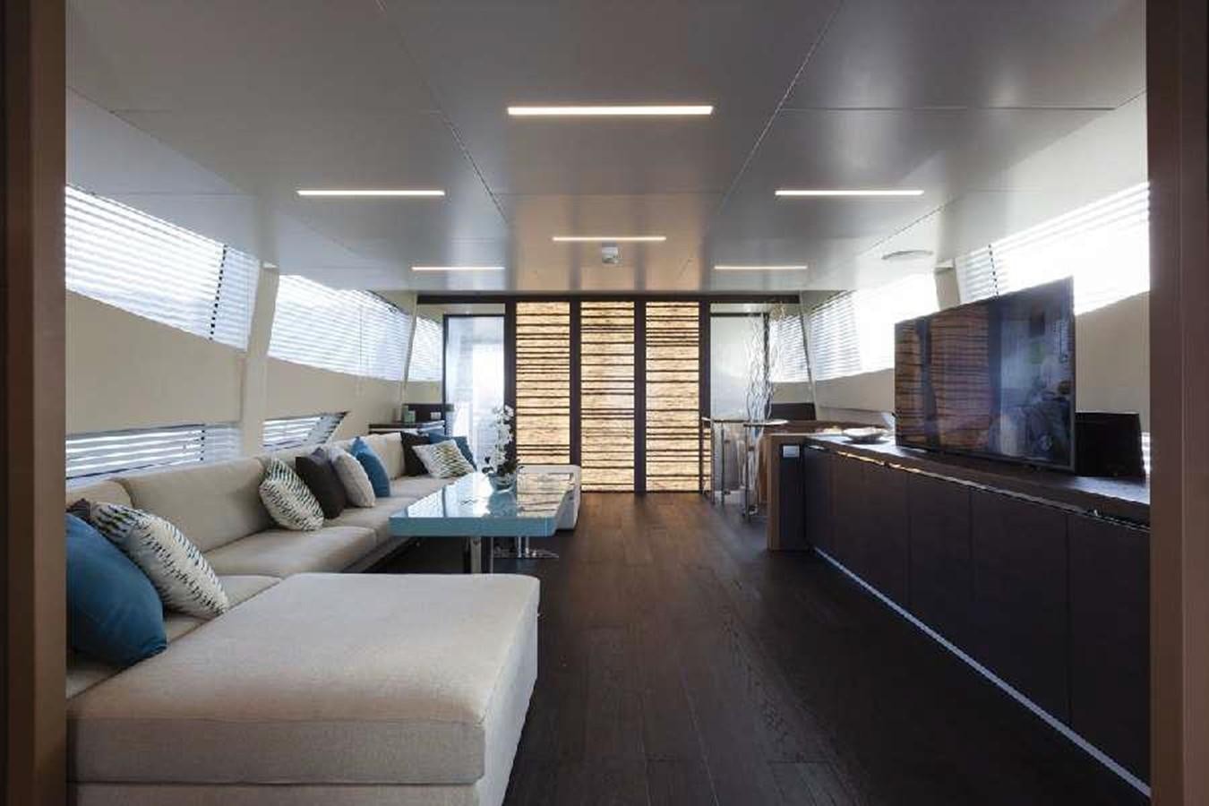 a living room with a wood floor aboard FRANCESCA Yacht for Sale