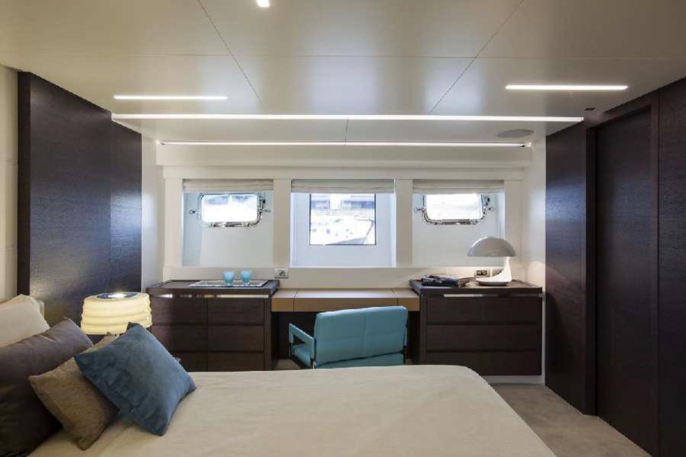 a bedroom with a bed and desk aboard FRANCESCA Yacht for Sale