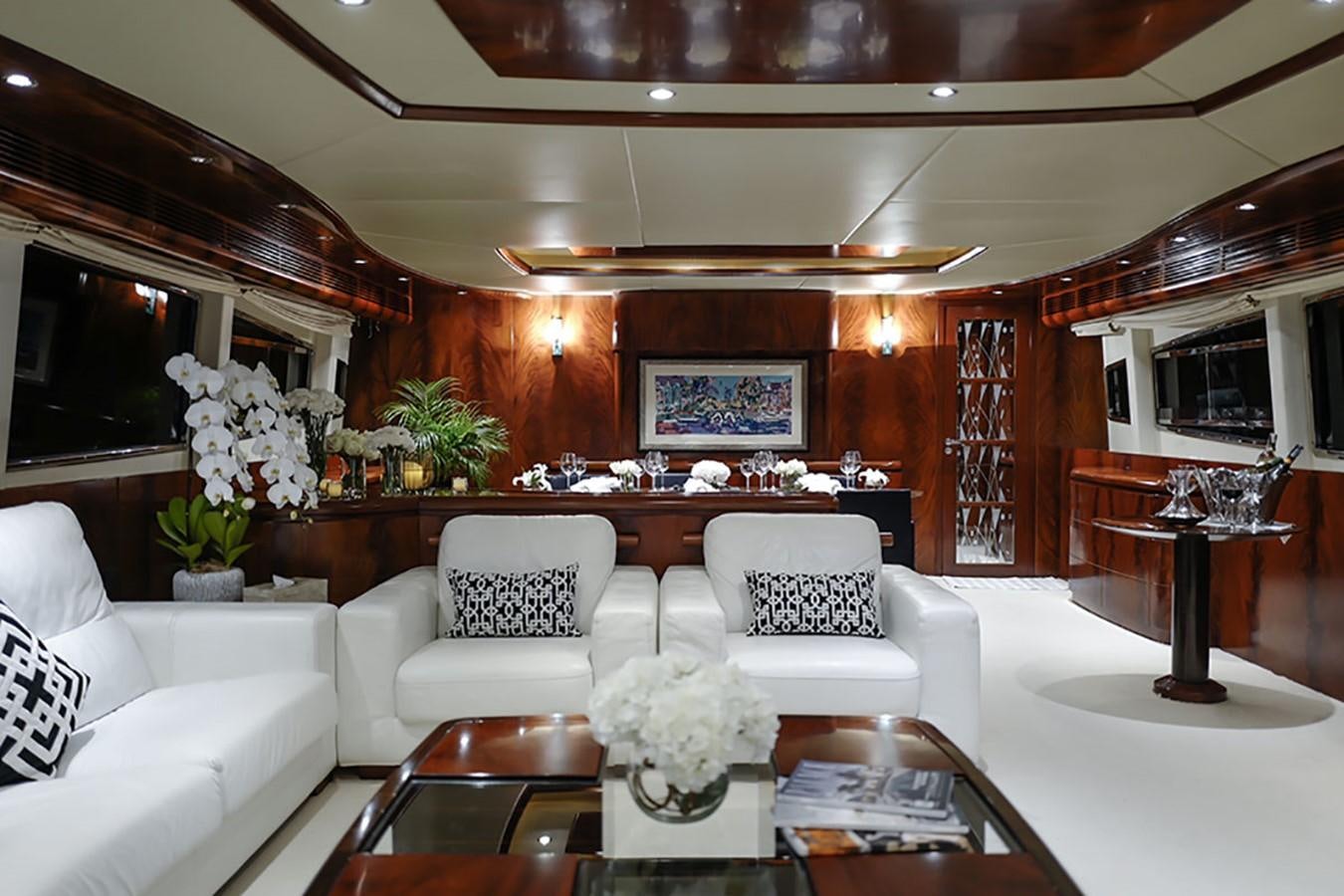 a living room with a large fireplace aboard FOR YOUR EYES ONLY Yacht for Charter