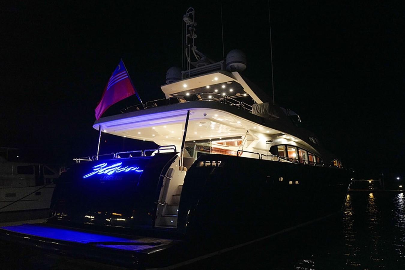 a boat with a flag on it aboard FOR YOUR EYES ONLY Yacht for Sale
