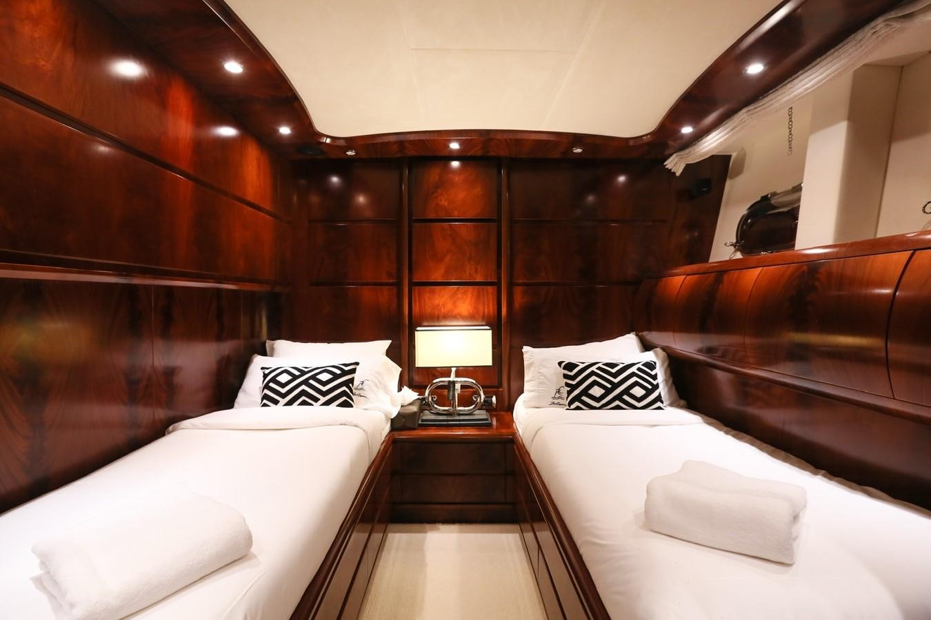a room with a bed and a mirror aboard FOR YOUR EYES ONLY Yacht for Charter