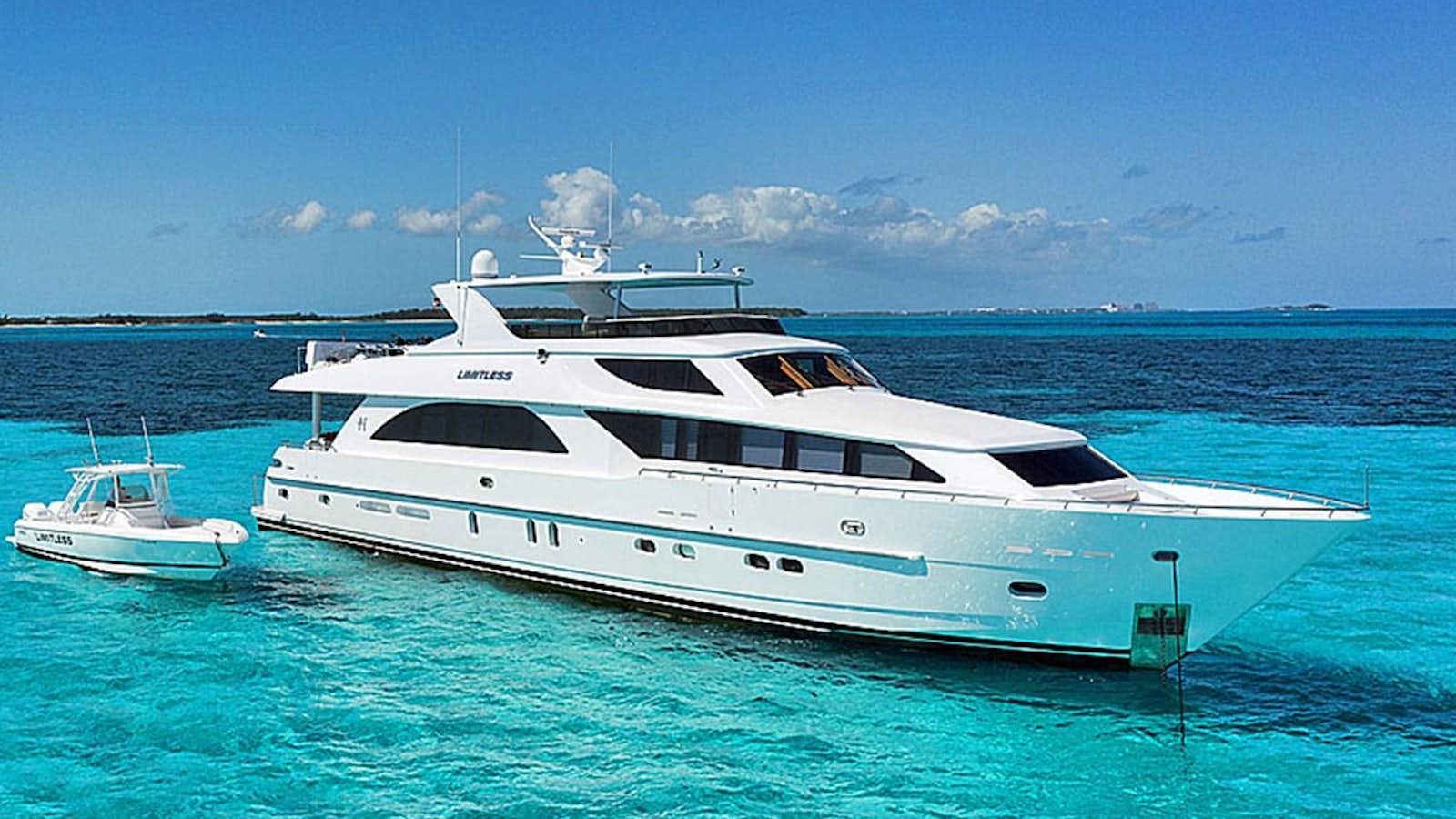 a white yacht in the water aboard LIMITLESS Yacht for Sale