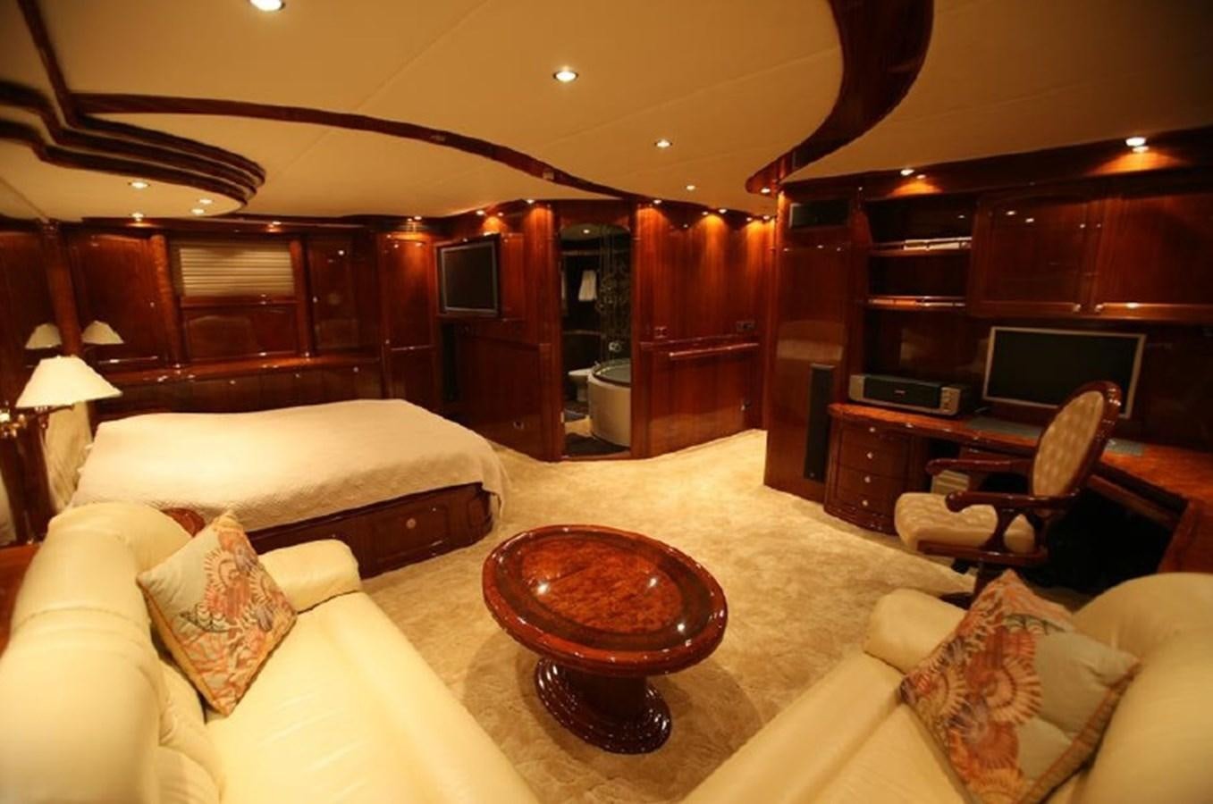 a living room with a fireplace aboard OCEAN STAR Yacht for Sale