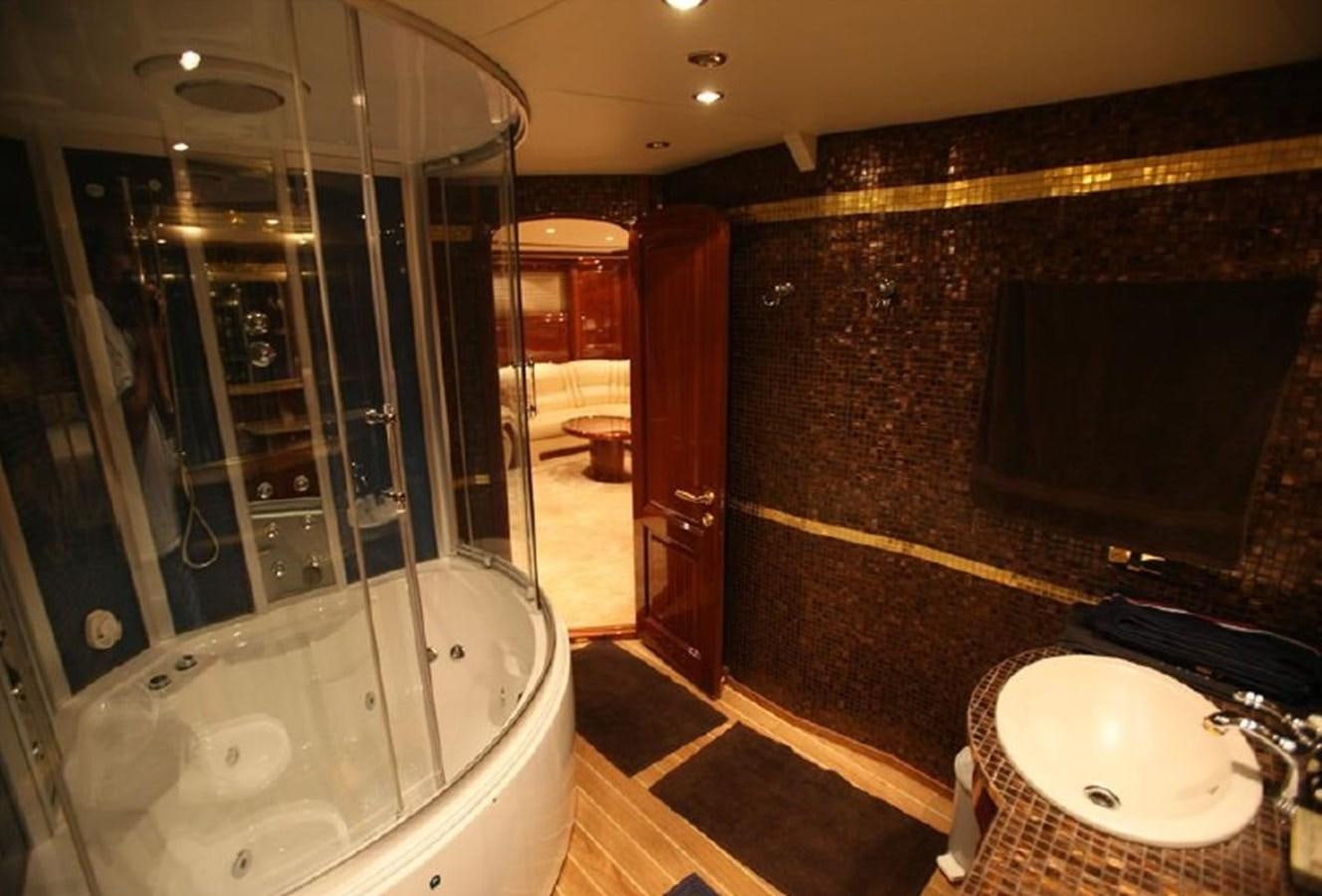 a bathroom with a glass shower aboard OCEAN STAR Yacht for Sale