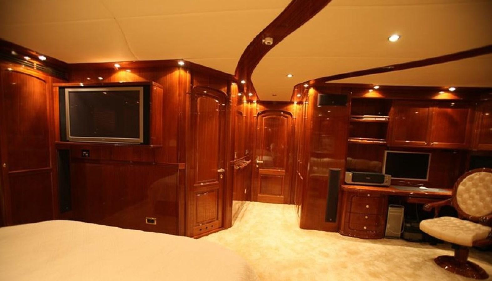 a room with a desk and a computer aboard OCEAN STAR Yacht for Sale