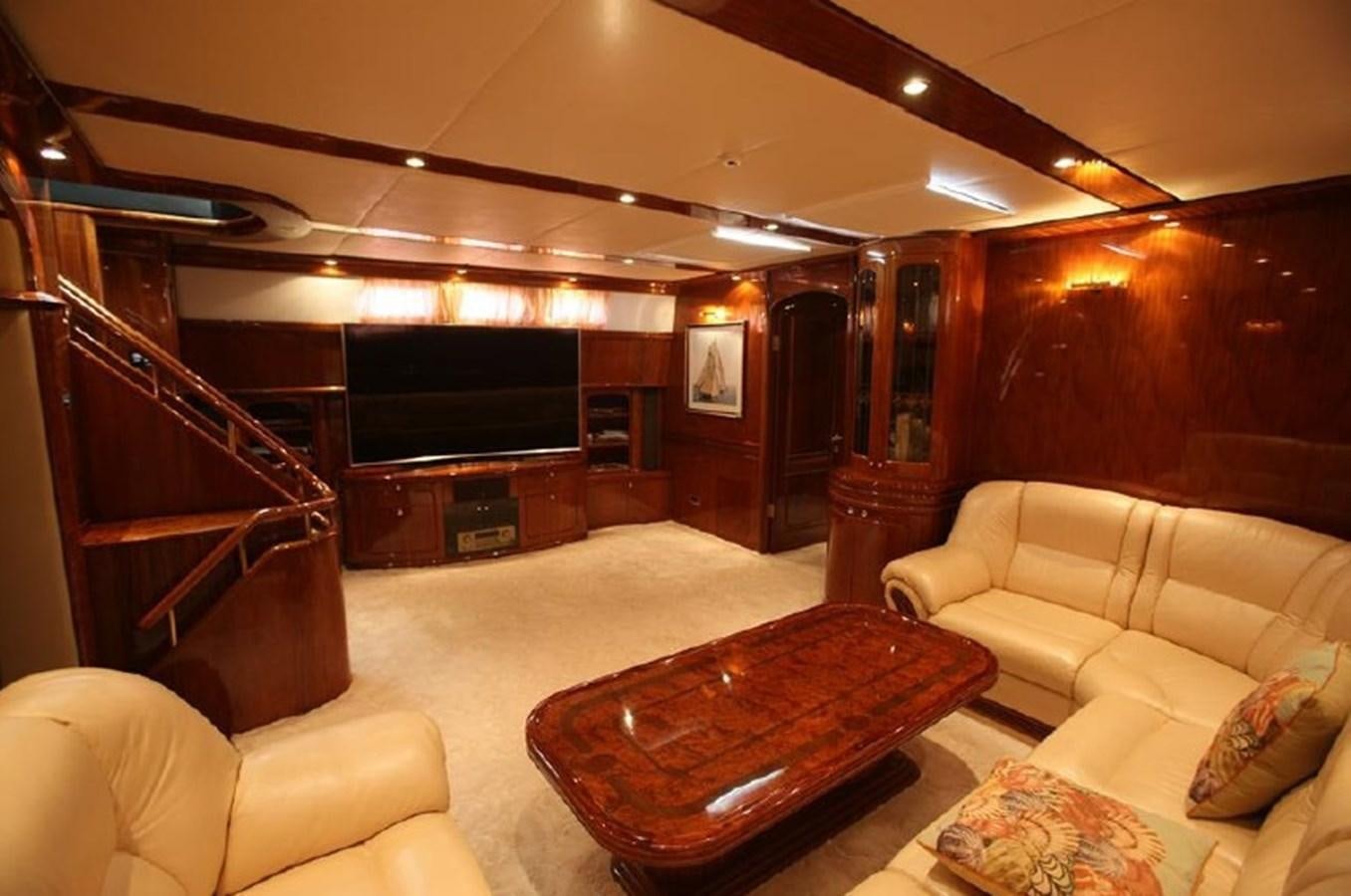 a living room with a fireplace aboard OCEAN STAR Yacht for Sale