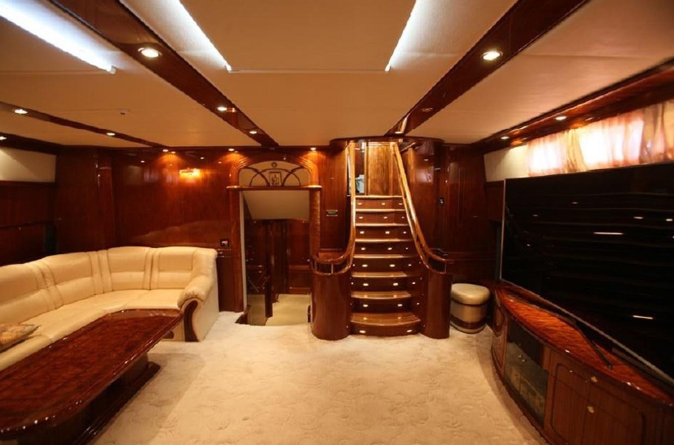 a room with a staircase and a couch aboard OCEAN STAR Yacht for Sale