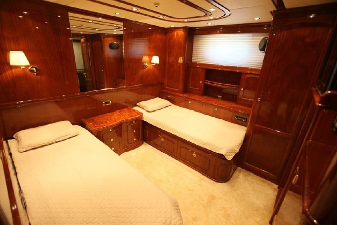 a room with two beds aboard OCEAN STAR Yacht for Sale