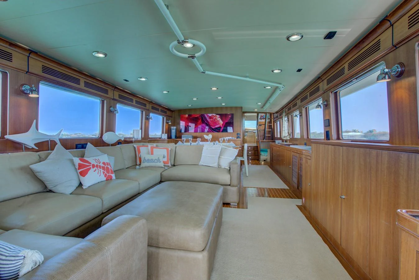 a train car with a couch and a television on the side aboard EXPLORER 97E-CB Yacht for Sale