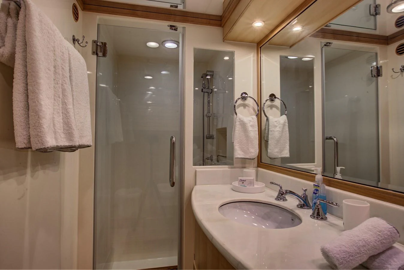 a bathroom with a sink and a shower aboard EXPLORER 97E-CB Yacht for Sale