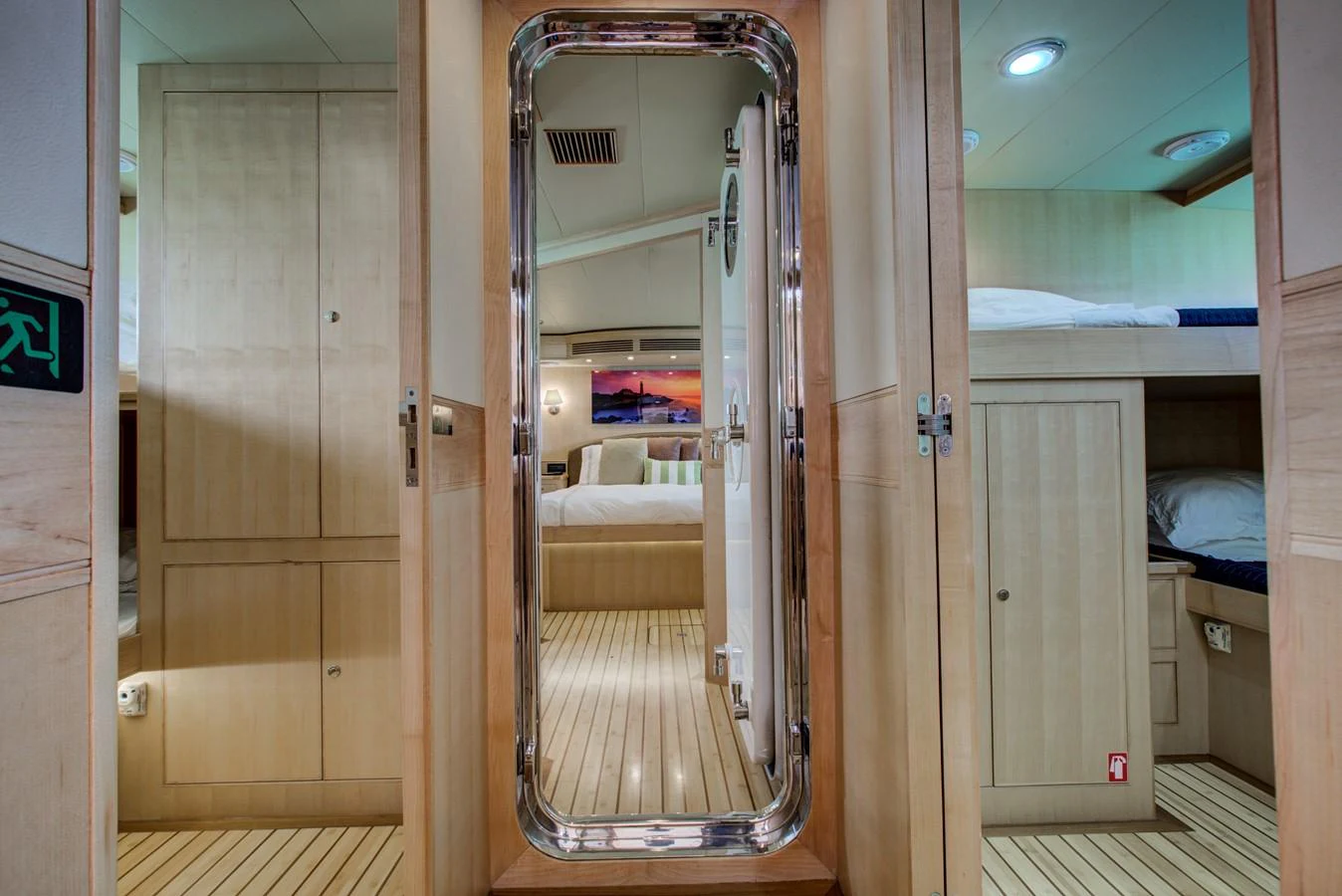 a room with a closet and a bed aboard EXPLORER 97E-CB Yacht for Sale