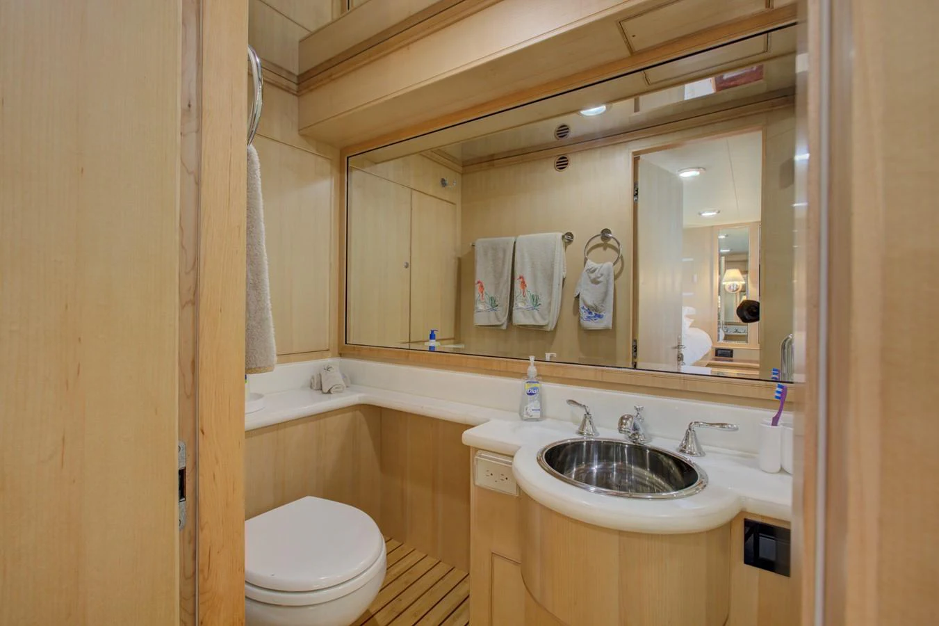 a bathroom with a large mirror aboard EXPLORER 97E-CB Yacht for Sale
