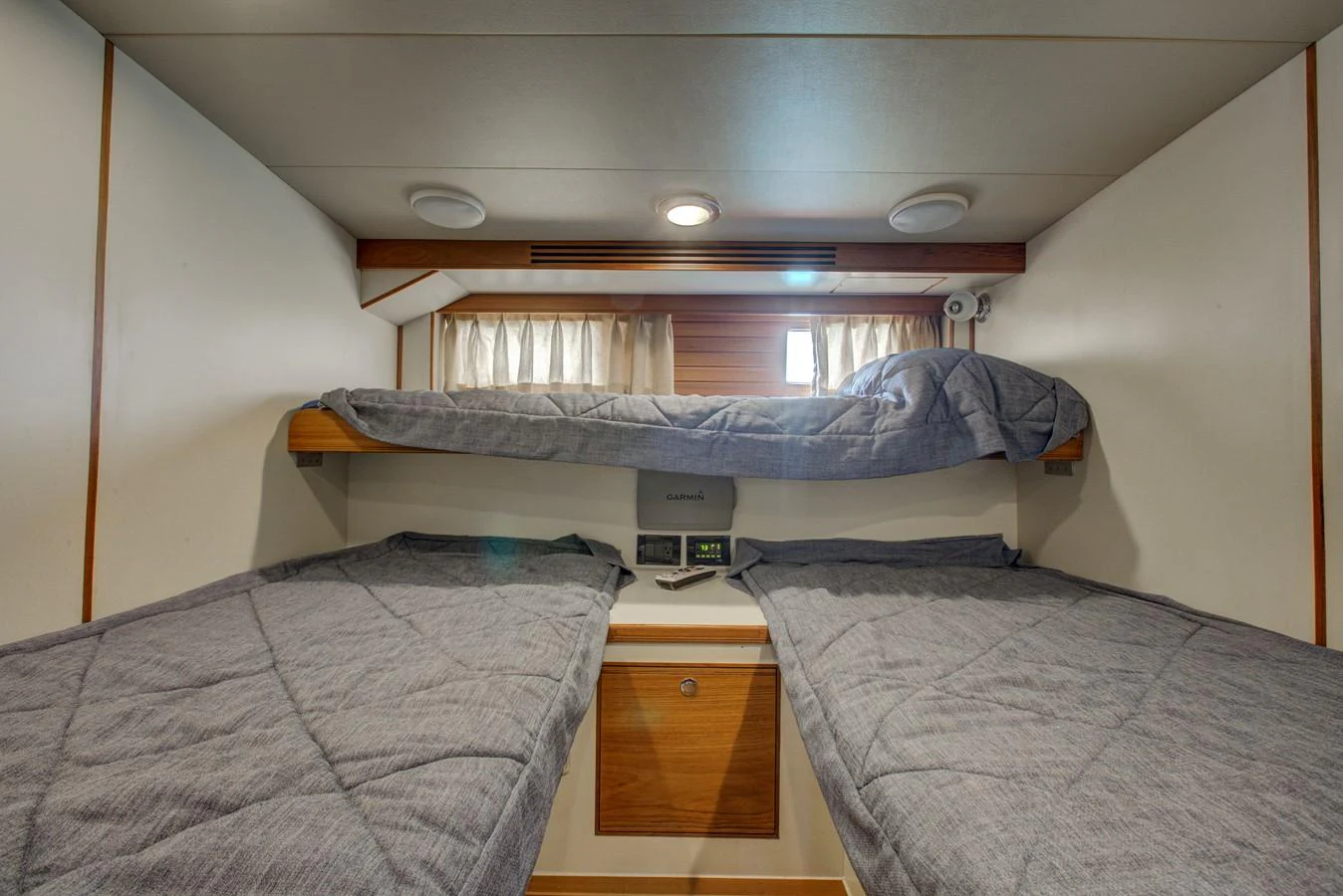 a couple of beds in a room aboard EXPLORER 97E-CB Yacht for Sale