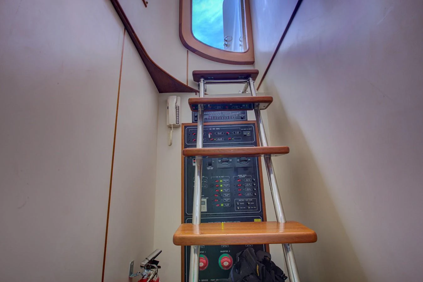 a computer tower on a wooden stand aboard EXPLORER 97E-CB Yacht for Sale