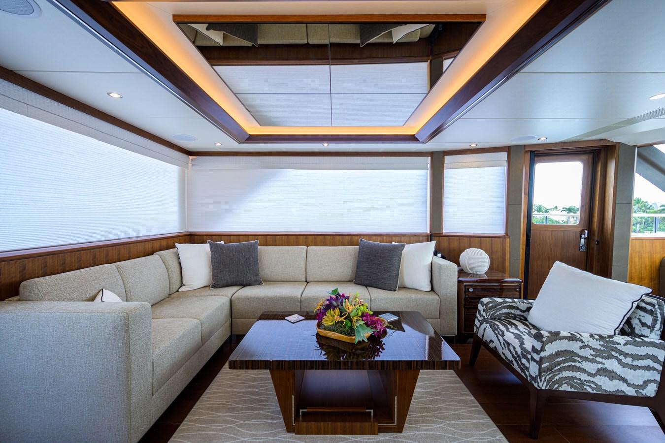 a living room with a couch and a table aboard ZEPHYR Yacht for Sale