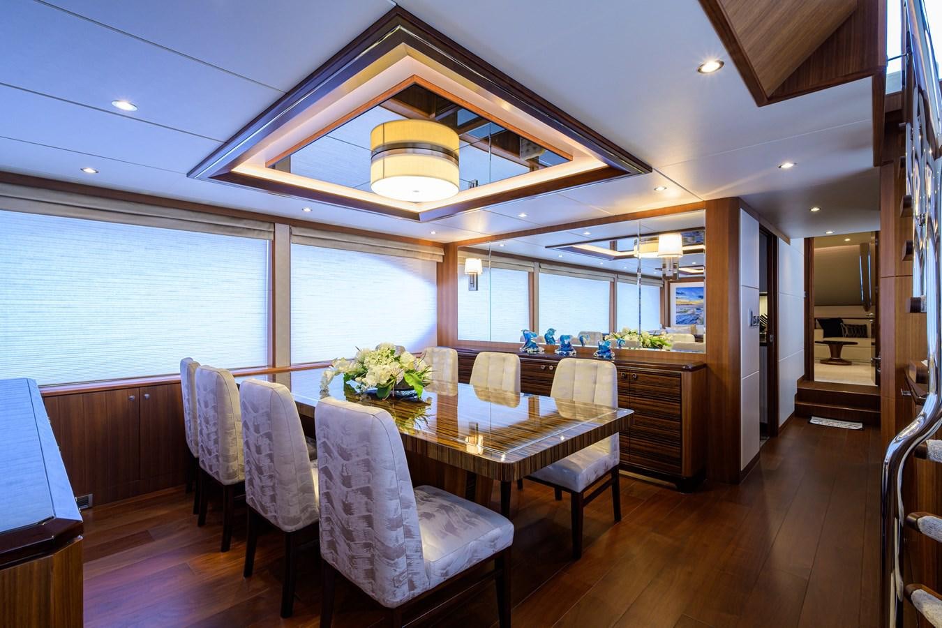 a large kitchen with a dining table aboard ZEPHYR Yacht for Sale