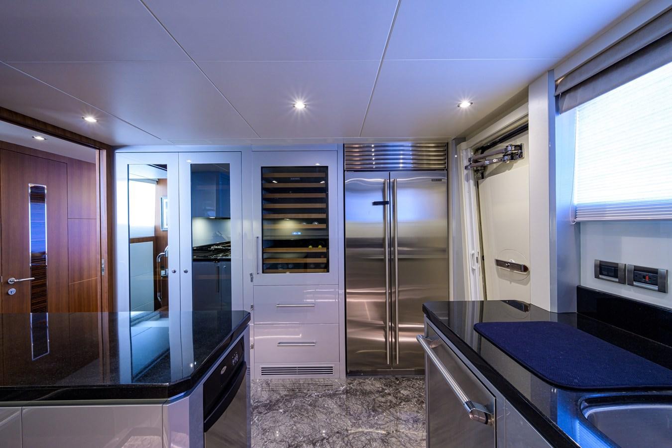 a kitchen with a large glass door aboard ZEPHYR Yacht for Sale