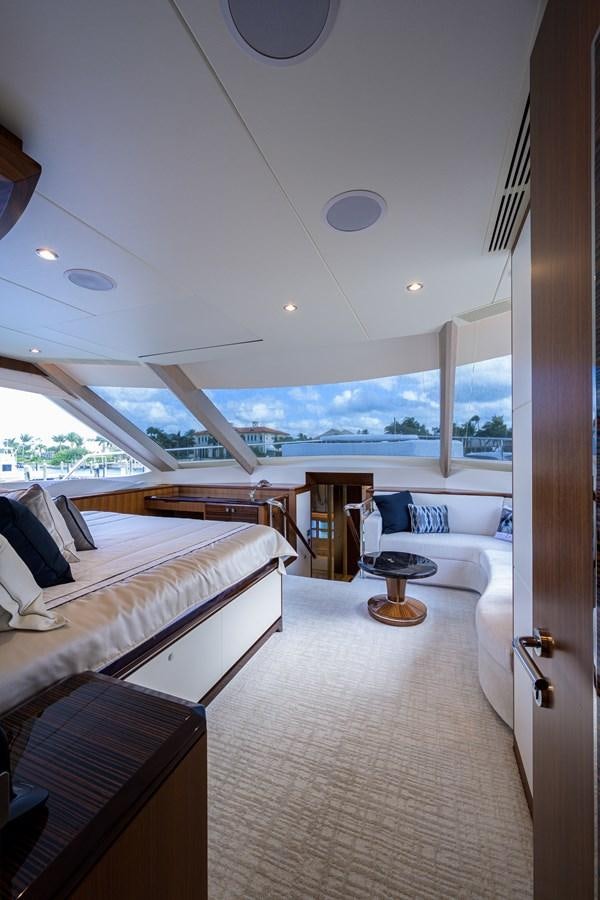 a room with a bed and a table aboard ZEPHYR Yacht for Sale
