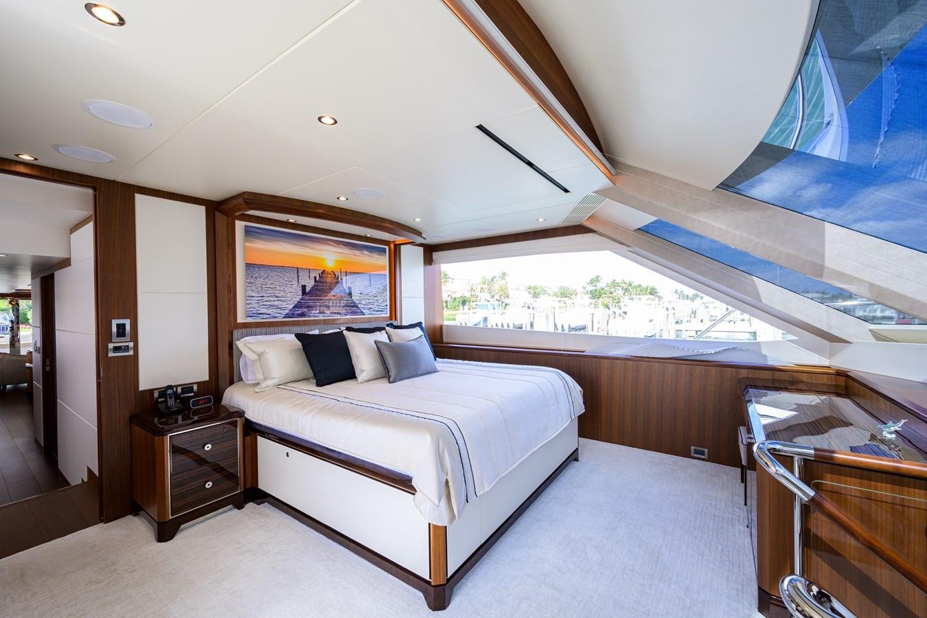 a room with a bed and a window aboard ZEPHYR Yacht for Sale
